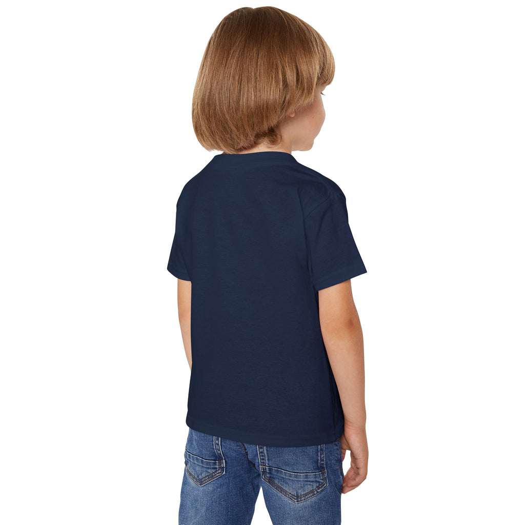 Child wearing a navy blue t-shirt and blue jeans on a white background
