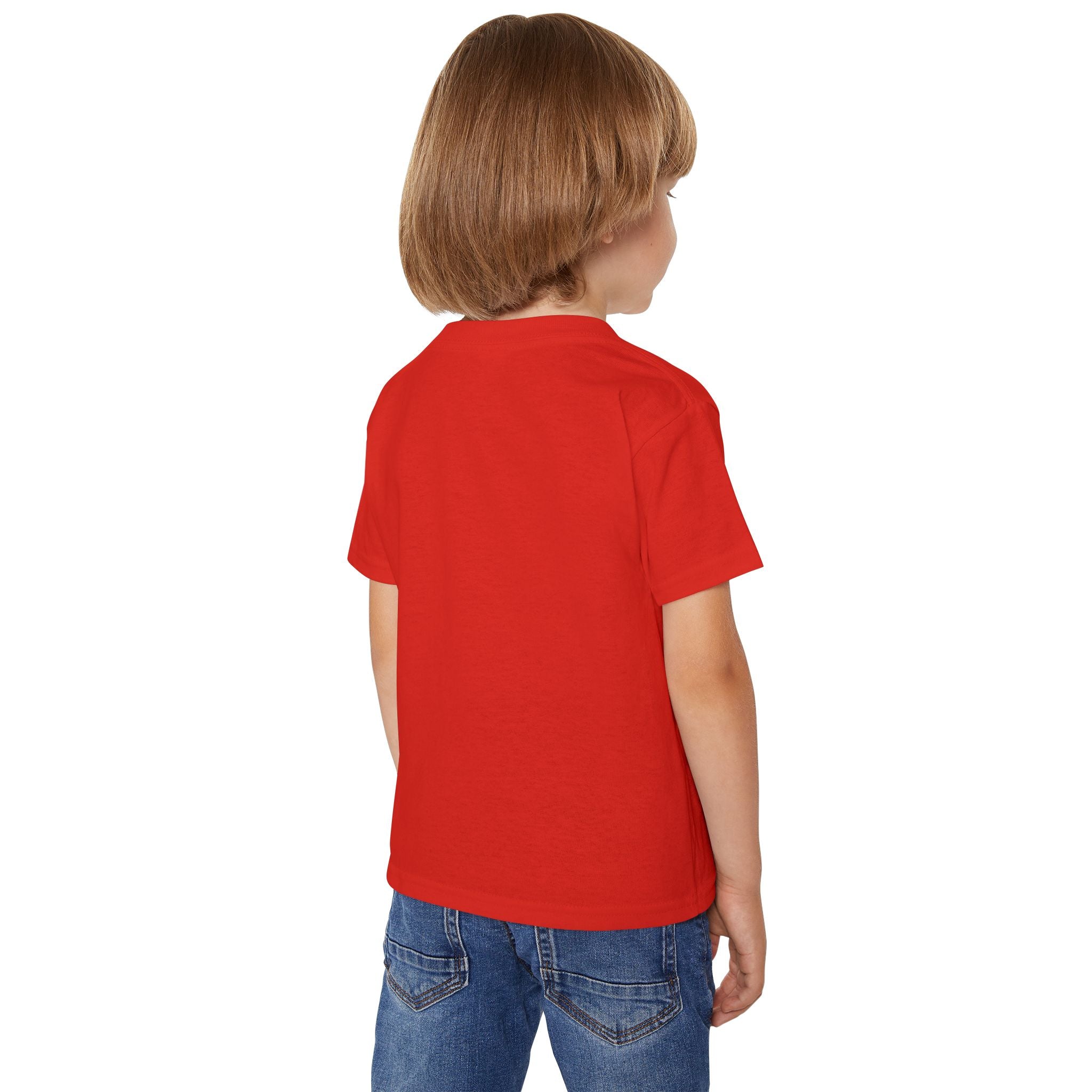 Child wearing a red t-shirt and blue jeans on a white background