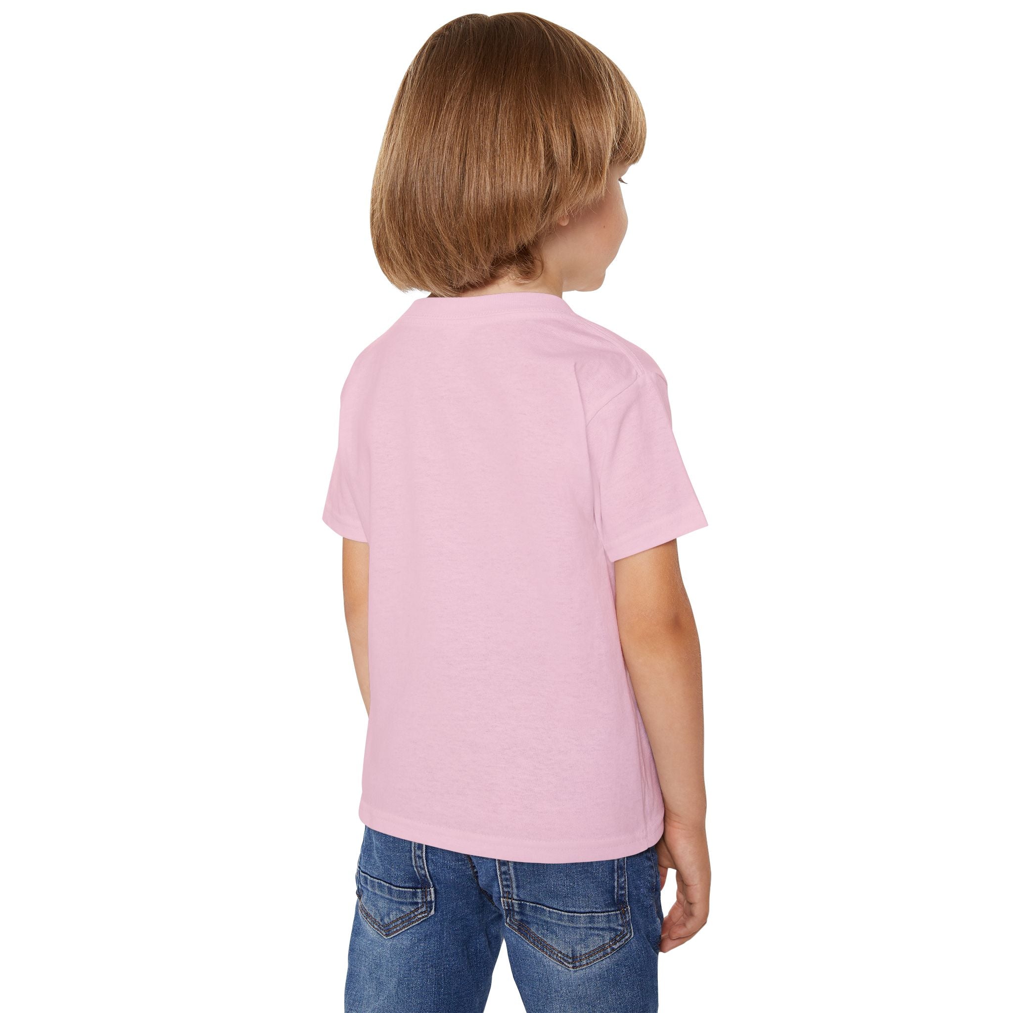 Child wearing a pink polo shirt and blue jeans on a white background