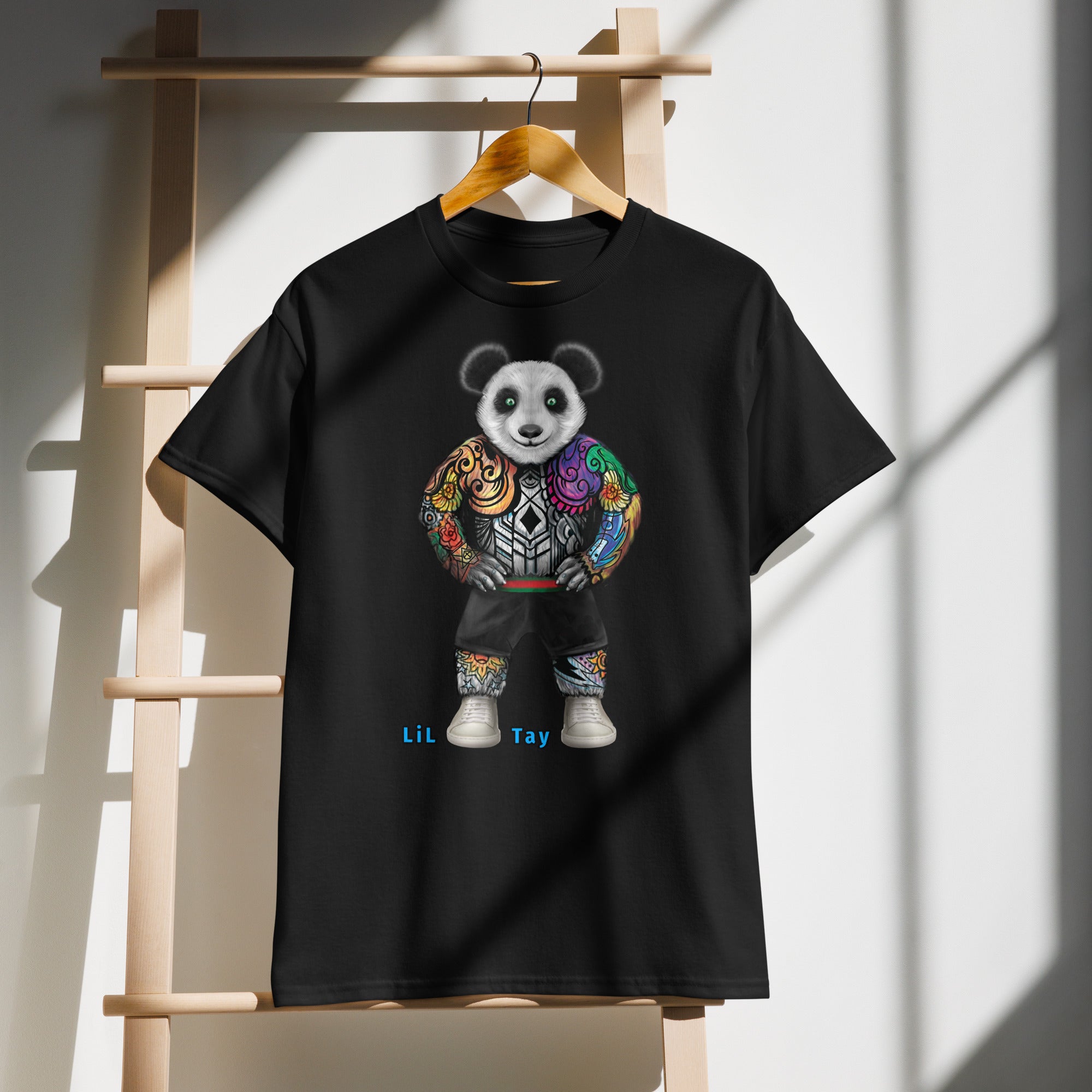 Black t-shirt with 'BUILT DIFFERENT' text on a wooden rack.